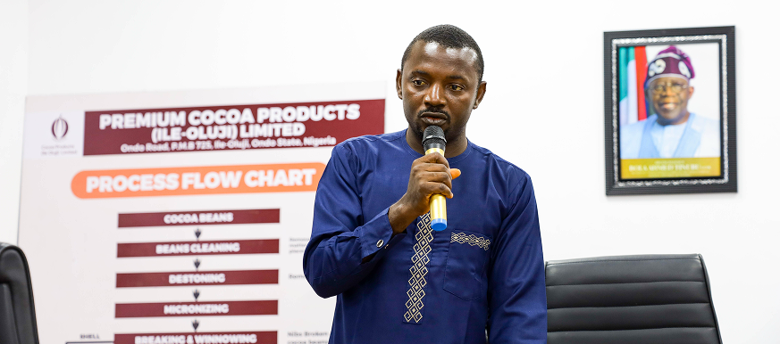 Man in business suit at Oluji Cocoa event